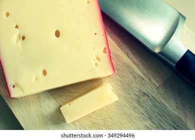 Fontina Cheese On A Cutting Board