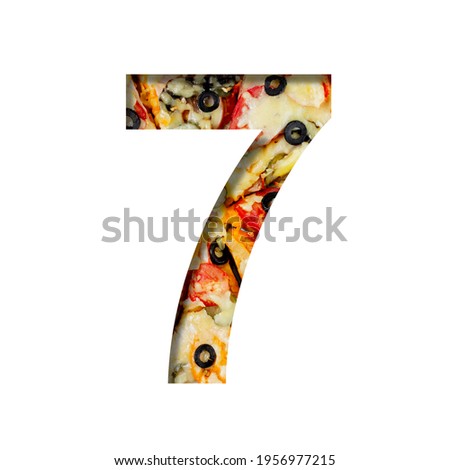 Fonts on pizza texture. Digit seven, 7, cut out of paper on a background of real pizza. Volumetric white fonts alphabet set