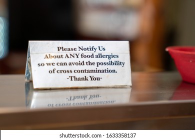 Food Allergy Cross Contamination Warning Placard Notice Sitting On Stable At A Restaurant