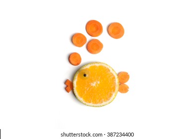 Food art creative concepts. Cute round fish made of fruits, orange, grapes and carrots. - Powered by Shutterstock