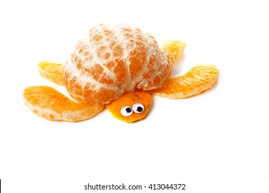 Food Art Creative Concepts. Turtle Made Of Mandarin Orange And Skin. Funny Dessert For Children. Fruit Isolated On A White Background.