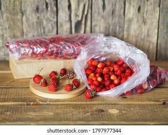 Food Background With Autumn Leftovers Of Strawberries. Packages With Strawberries For Storage In The Freezer For Future Use.