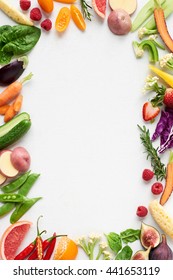 Food Background Border Frame Flat Lay Overhead Of Colorful Fresh Produce Raw Vegetables, Carrot Chilli Cucumber Purple Cabbage Spinach Rosemary Herb, Plenty Of Copy-space In Middle