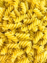 Colorful Pasta, Loop Noodles, Italian Pasta, Farfalle, Fusilli, Penne and  Others on a White Tablet Against a Neutral Background. Stock Photo - Image  of carbohydrates, decoration: 162951908