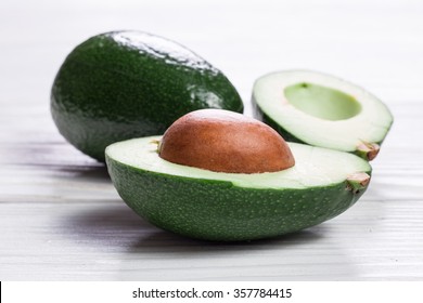 Food Background With Fresh Organic Avocado On Old Wooden Table