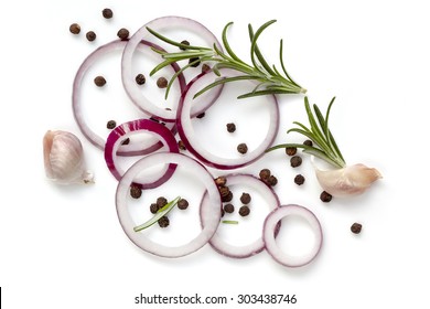 Food Background Of Onion Rings, Peppercorns, Rosemary And Garlic Cloves, Isolated On White.  Overhead View.
