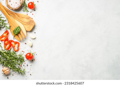 Food background with spices, herbs and utensil on white background. - Shutterstock ID 2318425607