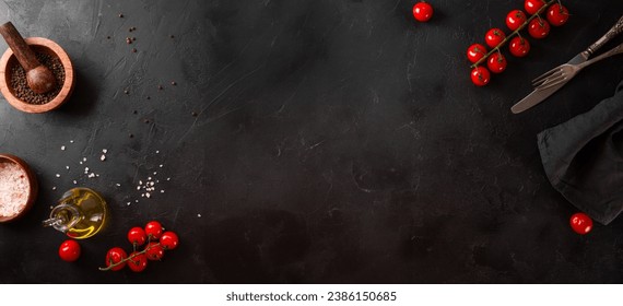 Food background, spices, tomatoes and oil on a black background, web banner with free space for text. High quality photo