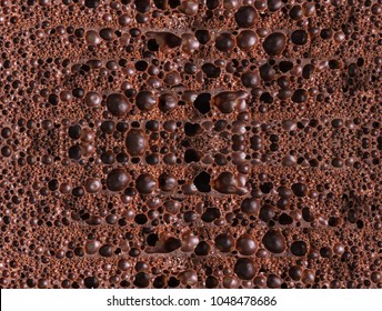 Food Background Texture Of Porous Chocolate Close-up