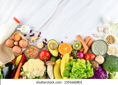 Food background top view with raw  healthy food ingredients including colorful vegetables and fruits on marble kitchen countertop with space for text - Powered by Shutterstock