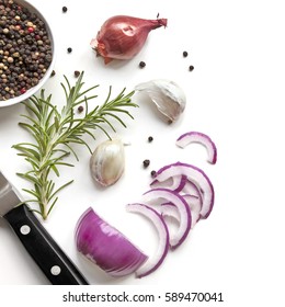 Food background top view, with red onion, rosemary, garlic, peppercorns, isolated on white.