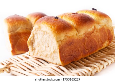 Food Baking Concept Fresh Baked Organic Homemade Soft Milk Loaf Bread On Wicker Bread Tray 