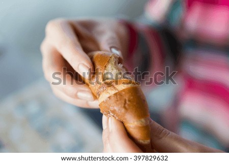 Similar – Image, Stock Photo Bread buns in a basket hanging on a blue wall