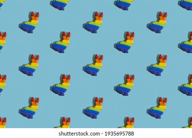 Food Banner. Seamless Pattern. Gay Pride. Lgbtqia Tolerance. Conceptual Art. Bunny Gingerbread Cookies With Rainbow Flag Icing Ornament Isolated On Blue Textured.