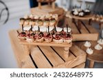 Food, a beautifully decorated catering banquet table with a variety of appetizers with cheese, ham, prosciutto and fruit. At a corporate, Christmas, birthday or wedding celebration. Buffet table. Buff