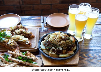 Food With Beer At Rustic Restaurant