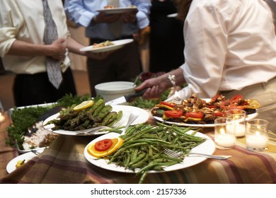 Food Being Served Buffet Style During A Wedding Event. This Was Shot With A Slow Shutter Speed, And There Is Some Movement Noticeable. Also Has A Very Shallow Depth Of Field.