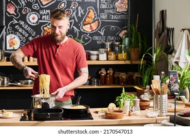 Food Blogger Cooking Pasta At Kitchen