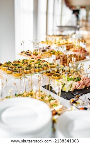 food buffer catering. Different canapes and appetizer on table