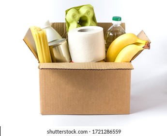 Food In A Cardboard Box. Food Donation Or Grocery Delivery Concept On White.