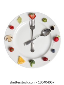 Food Clock Made Of Fruits And Vegetables On White Plate 