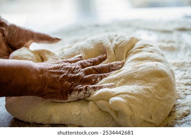 Food concept. Hands dough. Female hands making dough for pizza. Cooking dough for bread and pie by grandmother. Preparation doughs women's hands. Making dough by male hands at bakery. - Powered by Shutterstock