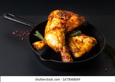 Food Concept Organic Roasted Or Grilled Chicken Leg Quarters In Skillet Iron Pan On Black Slate Stone Plate