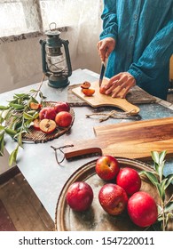 Food Conceptual Photo, A Women Cutting Peach Fruit With Another Raw Peach On The Table.