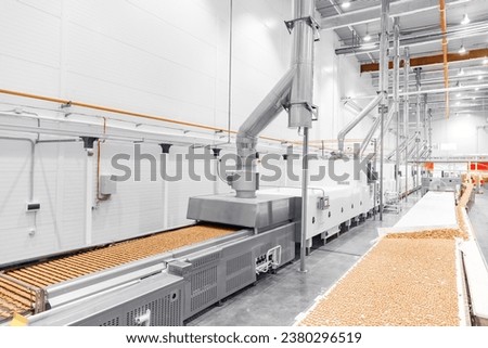 Food cookies industry banner, biscuit production in modern factory on conveyor belt.