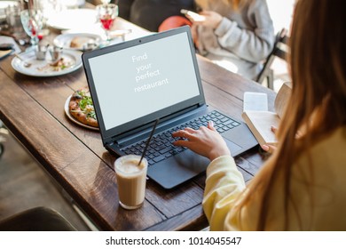 Food Critic Or Blogger Writing His Recommendation Or A Review Of Food And Service In A Restaurant                                                   