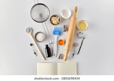 food and culinary concept - empty recipe book, cooking ingredients and baking tools on table - Powered by Shutterstock