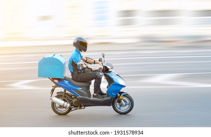 Food delivery boy on motorcycle moving fast to deliver food to customers, home and office delivery on motorbike, pizza online order. Express delivery service from cafes and restaurant, internet orders
