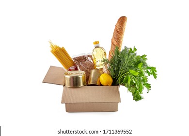 Food Delivery By Coronavirus. Volunteers Receive. Help Food. Donation Box. Package Of Food Essentials: Vegetable Oil, Cereals, Pasta, Bread.