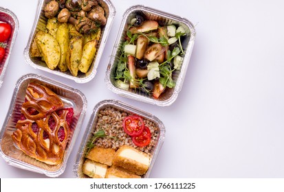 Food delivery. Dishes for dinner porridge, salad, potatoes with mushrooms on a white background. Copy space