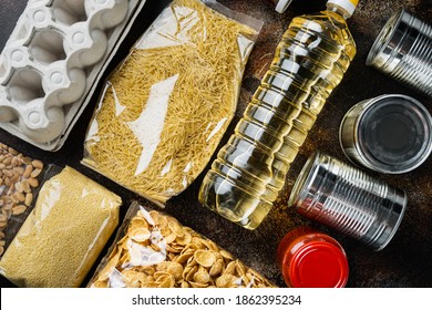 Food Delivery Or Donation During Covid Quarantine, Flat Lay, On Old Dark Table