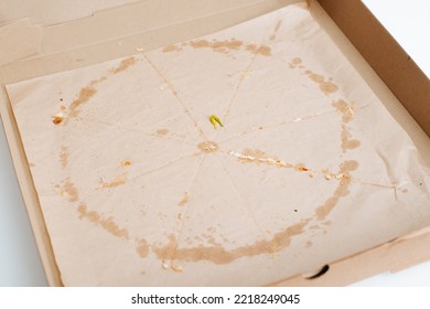 Food Delivery, Empty Cardboard Box With Crumbs And Traces Of Fat. Eaten Pizza.