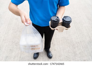 Food Delivery Man Handling Plastic Bags Shopping Online From Supermarket To Client Service Customer Front House, Express Grocery When Coronavirus Crisis