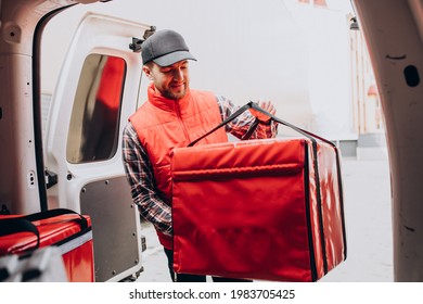 Food Delivery Man Putting Food Box Into A Car