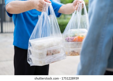 Food Delivery Man Wearing Mask Handing Plastic Bags Shopping Online From Supermarket To Female Client Service Customer Front House, Express Grocery When Coronavirus