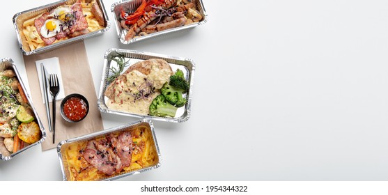 Food Delivery From Restaurant, Healthy And Tasty Meal During Covid-19 Virus. Sausages, Macaroni With Cheese, Divers Ready-made Hot Dishes In Containers, Fork And Eco Bag On Table, Top View, Panorama