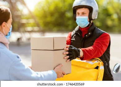 Food Delivery Service. Courier In Medical Mask Giving Lunch Boxes To Customer Girl Delivering Restaurant Meals On Moto Scooter Outdoor. - Shutterstock ID 1746420569