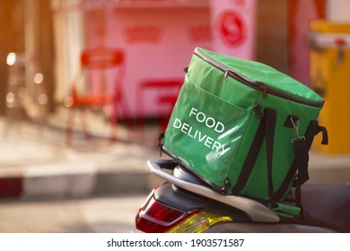 Food delivery service, green food box on motorcycles food delivery 