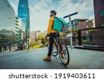Food delivery service, rider delivering food to clients with bicycle - Concepts about transportation, food delivery and technology