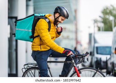 Food delivery service, rider delivering food to clints with bicycle - Concepts about transportation, food delivery and technology