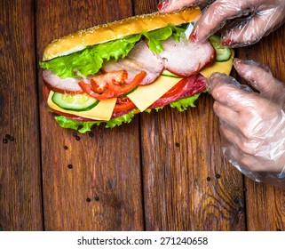 Food Design - Hands Making Meat And Cheese Sandwich With Fresh Vegetables At Wooden Background