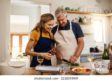 Food, digital tablet and senior couple cooking in kitchen in their home, checking online recipe on internet. Love, family and meal with vegetables for health, wellness and nutrition while streaming - Powered by Shutterstock