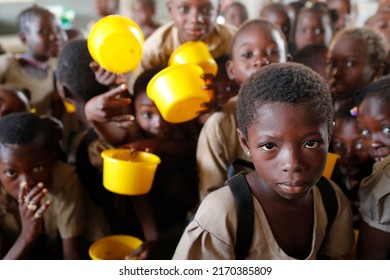 Food Distribution In An African Primary School. Lome. Togo.  05-30-2019