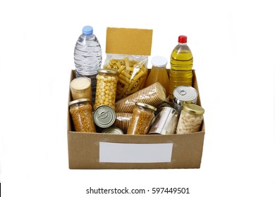 Food In A Donation Box For Neediness And Poverty Charity, Isolated In A White Background