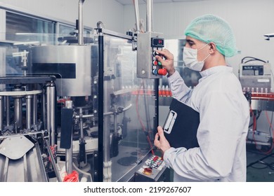 Food And Drink Factory Engineer  Staff Worker Operate Machine At Production Line. Beverage Products Industry.