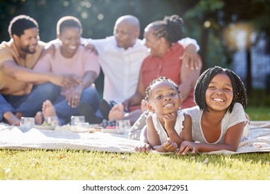 Food, Drink And A Family Picnic In Park With Kids, Parents And Grandparents. Men, Women And Children Relax Outdoors In Nature. Eating, Drinking And Laughing, A Happy Black Family Outside With Girls.